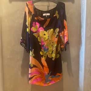 Trina Turk Sheath dress. Multi colored flower print on black background.